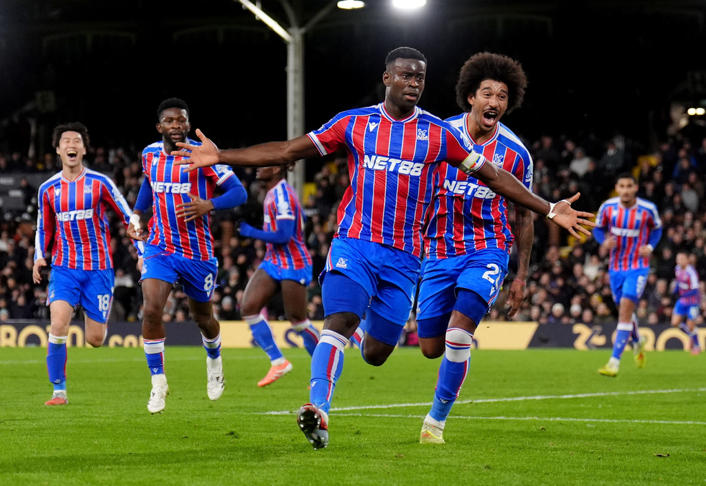 Crystal Palace's Marc Guehi celebrates after scoring his sides second goal during the English Premier League soccer match between Fulham and Crystal Palace, in London, Sunday, Dec. 7, 2025. (John Walton/PA via AP)