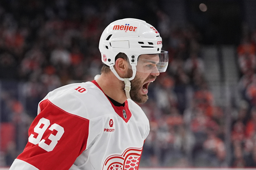 Detroit Red Wings' Alex DeBrincat reacts after scoring past Philadelphia Flyers goaltender Samuel Ersson during the first period of an NHL hockey game, Thursday, April 2, 2026, in Philadelphia. (AP Photo/Matt Rourke)