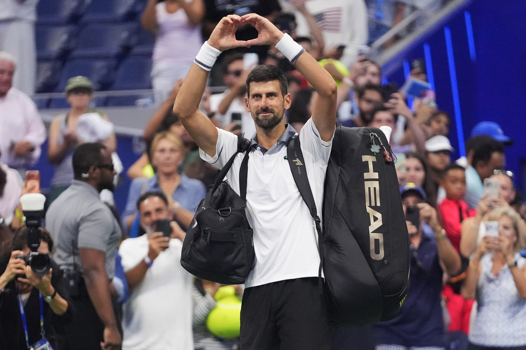 Novak Djokovic, of Serbia, gestures to the crowd after he lost to Mariano Navone, of Argentina, during the first round of the U.S. Open tennis championships Sunday, Aug. 30, 2026, in New York. (AP Photo/Frank Franklin II)