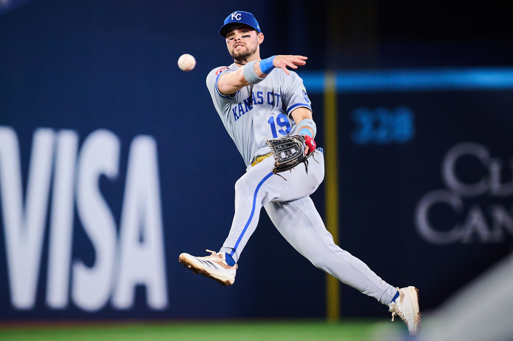 Kansas City Royals second baseman Michael Massey (19) throws to first during the fifth inning of a baseball game against the Toronto Blue Jays in Toronto, Tuesday, Aug. 25, 2026. (Sammy Kogan/The Canadian Press via AP)