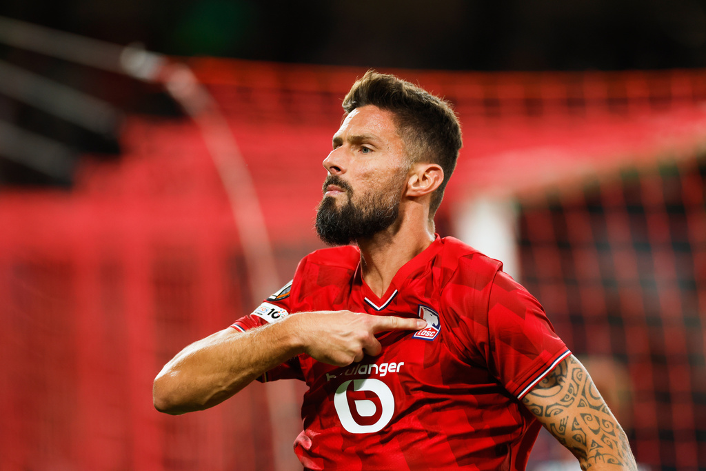 Lille's Olivier Giroud celebrates after scoring his sides second goal during the Europa League soccer match between Lille and Brann at the Pierre Mauroy stadium in Villeneuve d'Ascq, northern France, Thursday, Sept. 25, 2025. (AP Photo/Jean-Francois Badias)