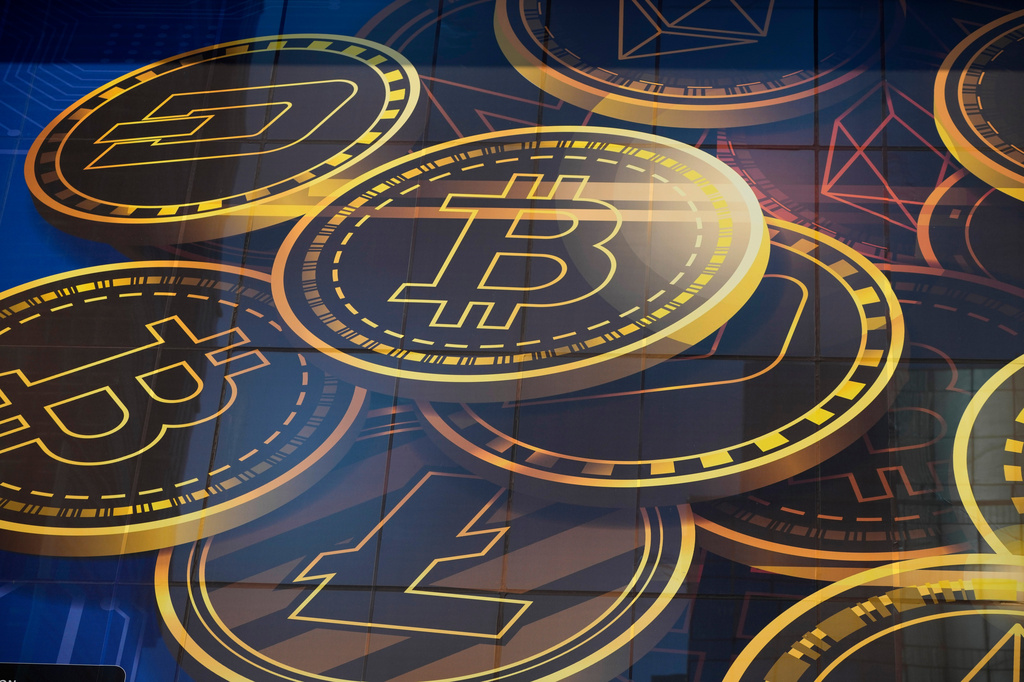FILE - An advertisement for the cryptocurrency Bitcoin is displayed on a building in Hong Kong on Nov. 18, 2021. (AP Photo/Kin Cheung, File)