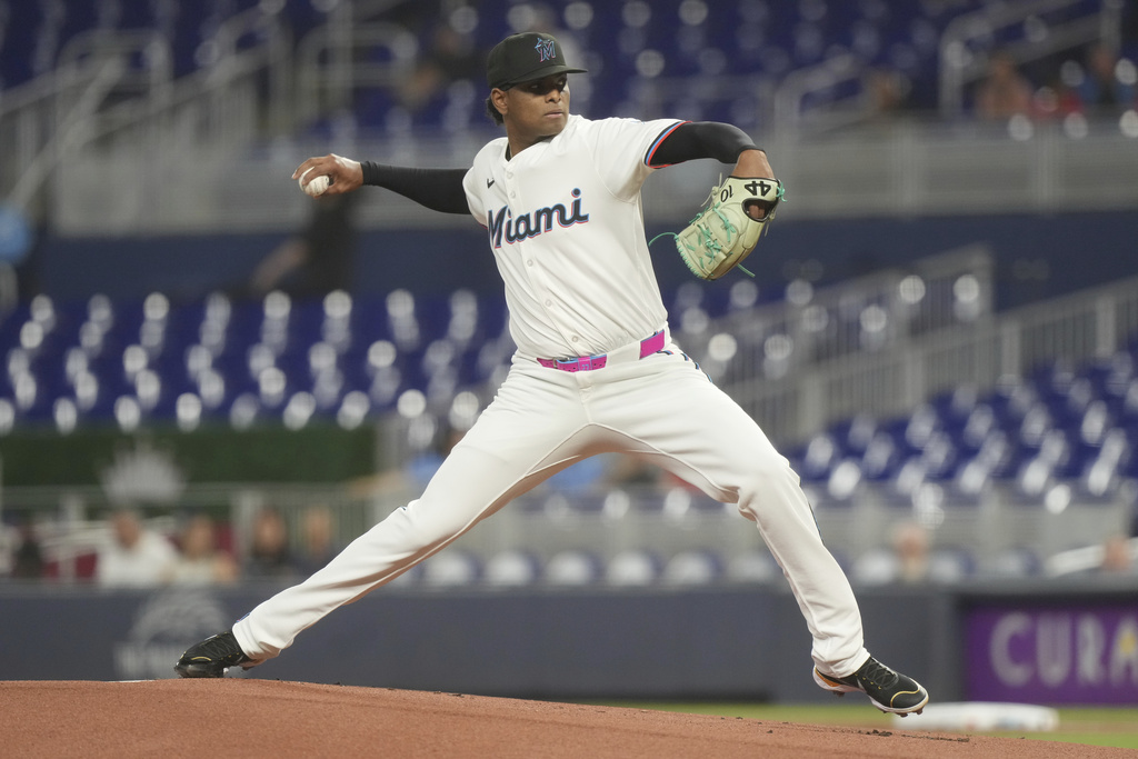 Miami Marlins starting pitcher Edward Cabrera aims a pitch during the first inning of a baseball game against the Atlanta Braves, Monday, Aug. 25, 2025, in Miami. (AP Photo/Marta Lavandier)