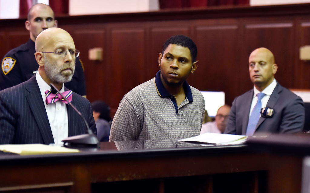 FILE - Randy Santos, center, is arraigned in criminal court for the murder of four homeless men, Oct. 6, 2019, in New York. (Rashid Umar Abbasi/New York Post via AP, Pool)