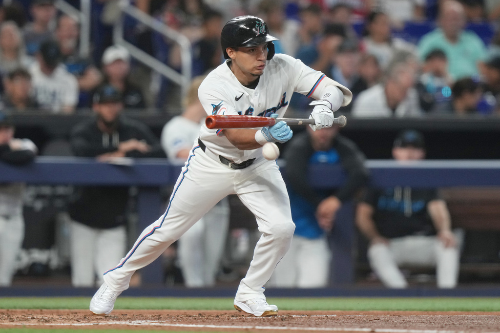 Miami Marlins' Javier Sanoja bunts the ball in the second inning of a baseball game against the Tampa Bay Rays Saturday, June 6, 2026, in Miami. (AP Photo/Marta Lavandier)