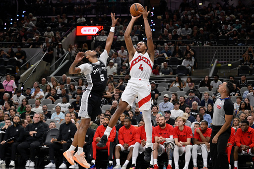 Toronto Raptors guard Scottie Barnes (4) shoots against San Antonio Spurs guard Stephon Castle during the second half of an NBA basketball game, Monday, Oct. 27, 2025, in San Antonio. (AP Photo/Darren Abate) Toronto Raptors guard Scottie Barnes (4) shoots against San Antonio Spurs guard Stephon Castle during the second half of an NBA basketball game, Monday, Oct. 27, 2025, in San Antonio. (AP Photo/Darren Abate)
