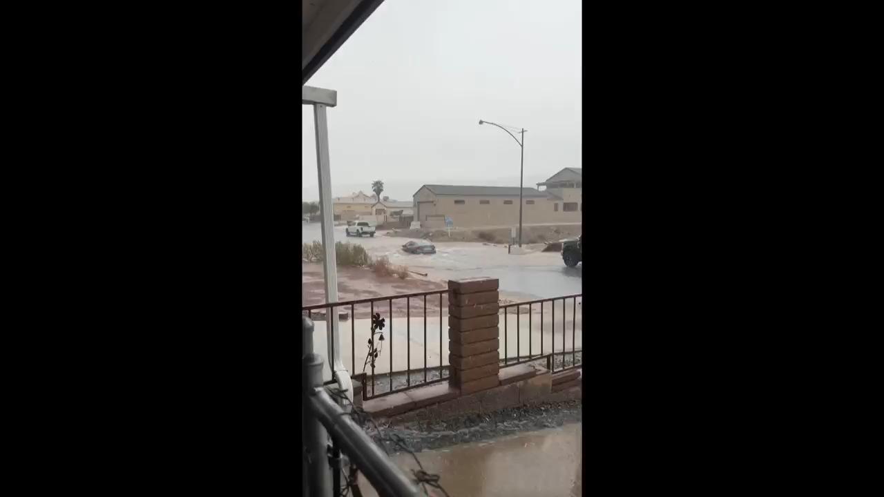 Bands of rain swept across the U.S. Southwest causing desert rivers to surge and usually dry arroyos to rage with floodwater. Forecasters said the flood risk would move into parts of the central U.S. beginning late Tuesday and into Wednesday.