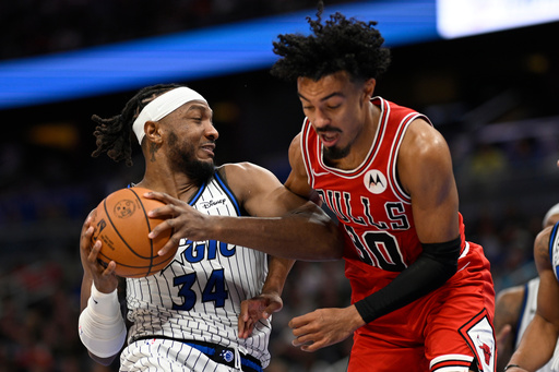 Orlando Magic center Wendell Carter Jr. (34) grabs a rebound in front of Chicago Bulls guard Tre Jones (30) during the second half of an NBA basketball game, Saturday, Oct. 25, 2025, in Orlando, Fla. (AP Photo/Phelan M. Ebenhack) Orlando Magic center Wendell Carter Jr. (34) grabs a rebound in front of Chicago Bulls guard Tre Jones (30) during the second half of an NBA basketball game, Saturday, Oct. 25, 2025, in Orlando, Fla. (AP Photo/Phelan M. Ebenhack)