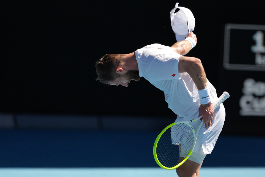 Corentin Moutet of France bows during his third round match against Carlos Alcaraz of Spain at the Australian Open tennis championship in Melbourne, Australia, Friday, Jan. 23, 2026. (AP Photo/Asanka Brendon Ratnayake)