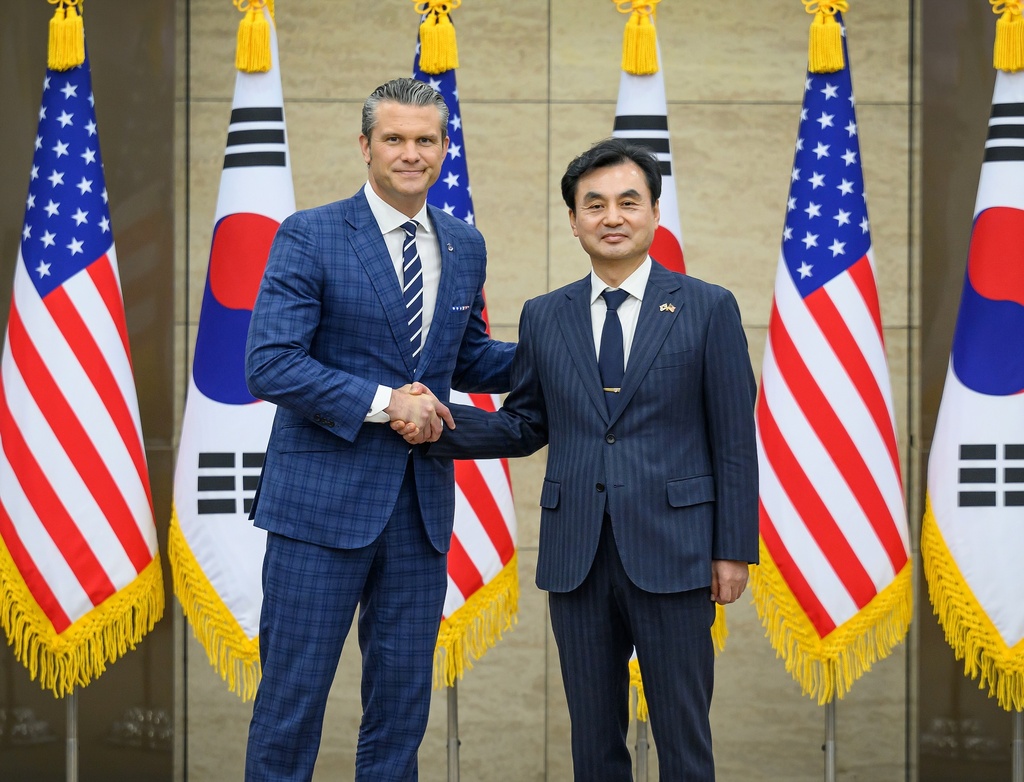 In this photo provided by the South Korea Defense Ministry, U.S. Defense Secretary Pete Hegseth, left, shakes hands with South Korean Defense Minister Ahn Gyu-back for a photo at the 57th Security Consultative Meeting at the Defense Ministry in Seoul, South Korea, Tuesday, Nov. 4, 2025. (South Korea Defense Ministry via AP)