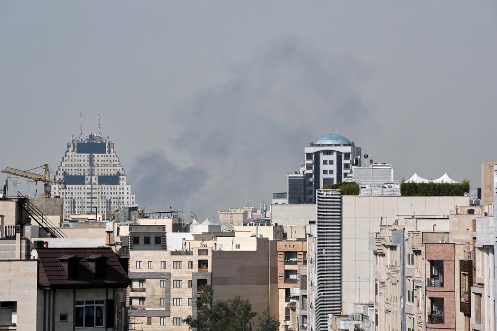 Smoke rises on the skyline after an explosion in Tehran, Iran, Saturday, Feb. 28, 2026.(AP Photo/Vahid Salemi)