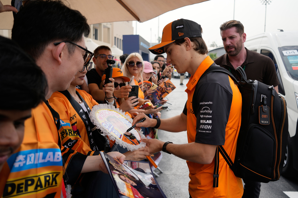 McLaren driver Oscar Piastri of Australia arrives for the first practice for the he Abu Dhabi Formula One Grand Prix in Abu Dhabi, United Arab Emirates, Friday, Dec. 5, 2025. (AP Photo/Darko Bandic)