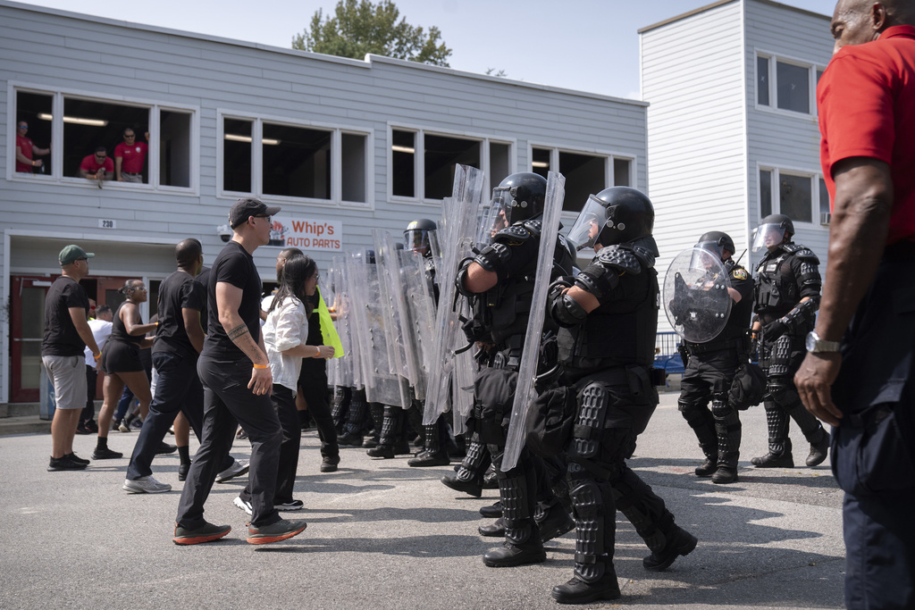 During a training exercise involving local and federal law enforcement organized by the U.S. Capitol Police, people portraying protesters confront police officers wearing protective equipment at the U.S. Secret Service James J. Rowley Training Center Friday, Sept. 5, 2025, in Laurel, Md. (AP Photo/Mark Schiefelbein)