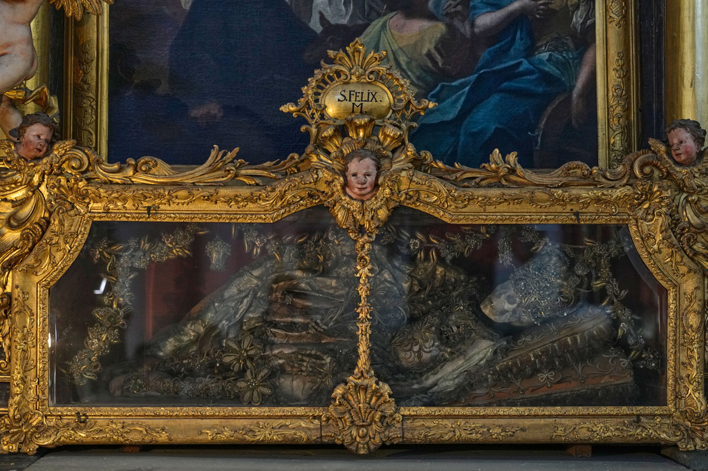 An elaborately decorated skeleton lies in the catholic monastery church of Banz in Bad Staffelstein, Germany, Saturday, May 2, 2026. (AP Photo/Matthias Schrader)