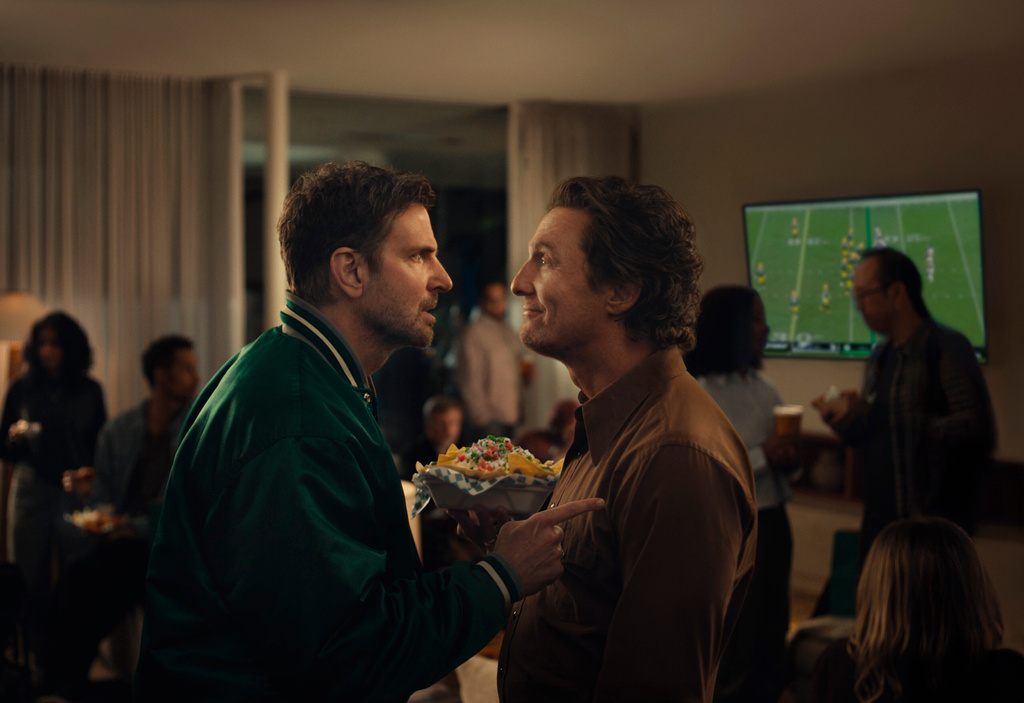 This undated image provided by Uber Eats shows Bradley Cooper, left, and Matthew McConaughey in a scene from the Uber Eats 2026 Super Bowl NFL football spot. (Uber Eats via AP)