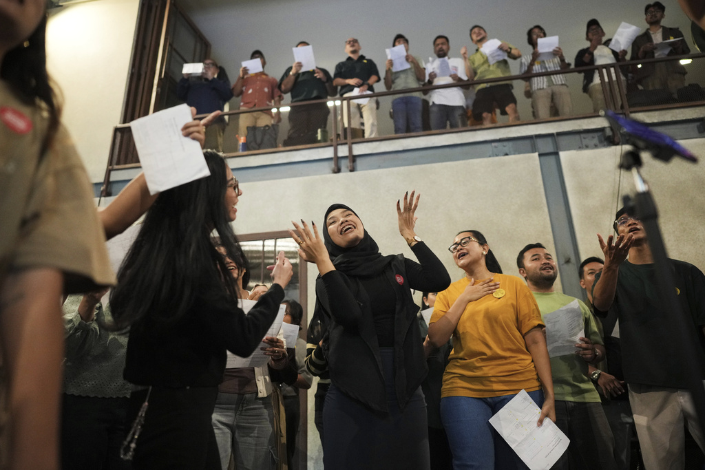 Participants sing during a gathering of "Nyanyi Bareng Jakarta" or "Singing Together Jakarta" community in Jakarta, Indonesia, Saturday, July 19, 2025. (AP Photo/Dita Alangkara)