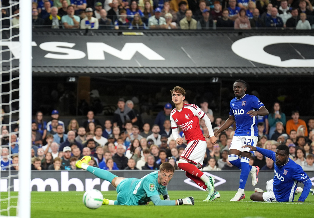 Arsenal's Max Dowman, centre, scores their side's third goal during the League Cup third round soccer match between Ipswich Town and Arsenal in Ipswich, England, Tuesday, Sept. 15, 2026. (Joe Giddens/PA via AP)