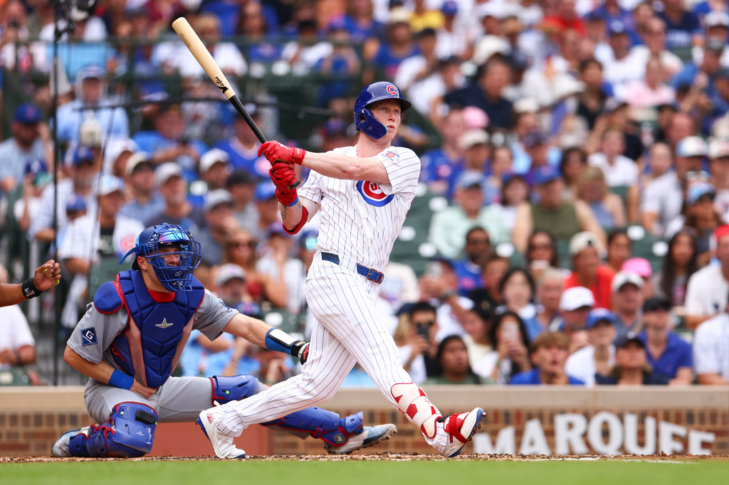 Chicago Cubs designated hitter Pete Crow-Armstrong follows through on an RBI double during the second inning of a baseball game against the Los Angeles Dodgers in Chicago, Wednesday, Aug. 5, 2026. (AP Photo/Jessie Alcheh)