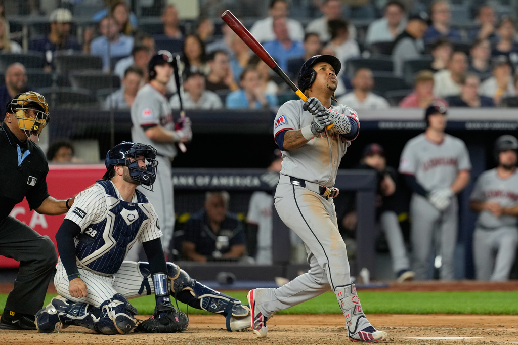 Cleveland Guardians' José Ramírez looks after his solo home run during the sixth inning of a baseball game against the New York Yankees, Wednesday, June 3, 2026, in New York. (AP Photo/Seth Wenig)
