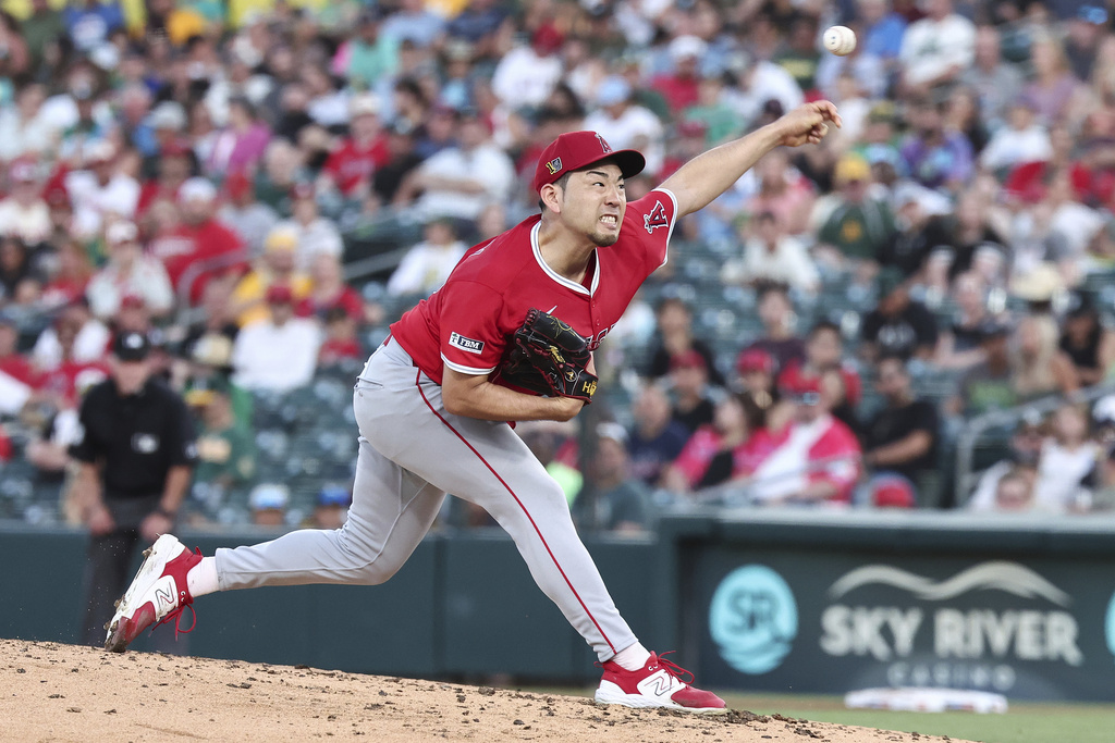 Los Angeles Angels pitcher Yusei Kikuchi throws to the Athletics during the second inning of a baseball game Friday, Aug. 15, 2025, in West Sacramento, Calif. (AP Photo/Sara Nevis)