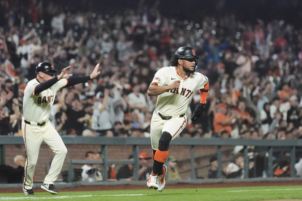 San Francisco Giants' Luis Matos runs home to score against the Arizona Diamondbacks during the sixth inning of a baseball game in San Francisco, Monday, Sept. 8, 2025. (AP Photo/Jeff Chiu)