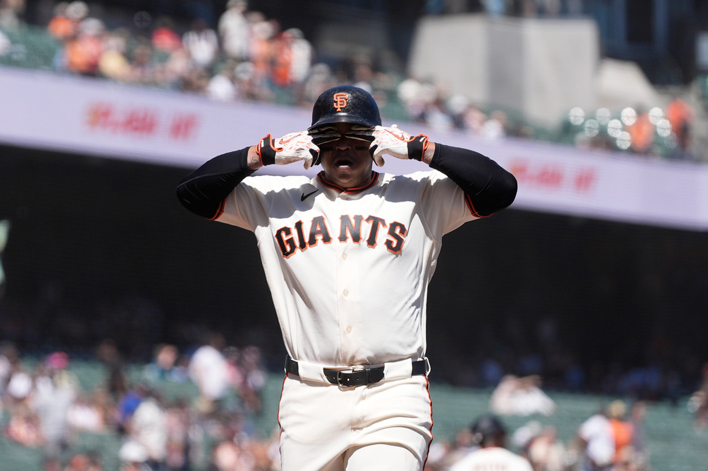 San Francisco Giants' Rafael Devers celebrates after hitting a two-run home run against the Cincinnati Reds during the fifth inning of a baseball game, Wednesday, Aug. 26, 2026, in San Francisco. (AP Photo/Jeff Chiu)