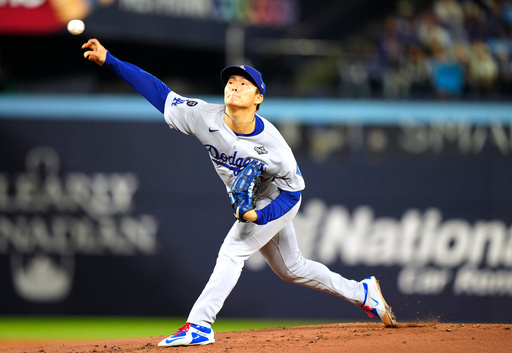 Los Angeles Dodgers pitcher Yoshinobu Yamamoto (18) delivers against the Toronto Blue Jays during the first inning in Game 2 of baseball's World Series, Saturday, Oct. 25, 2025, in Toronto. (Frank Gunn/The Canadian Press via AP) Los Angeles Dodgers pitcher Yoshinobu Yamamoto (18) delivers against the Toronto Blue Jays during the first inning in Game 2 of baseball's World Series, Saturday, Oct. 25, 2025, in Toronto. (Frank Gunn/The Canadian Press via AP)
