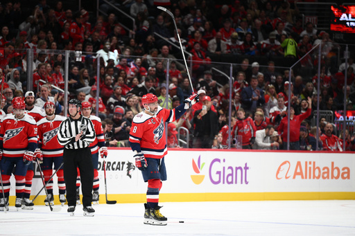 Washington Capitals left wing Alex Ovechkin (8) raises his stick to the crowd after he was recognized for playing in his 1,500th NHL hockey game during a break in the action in the first period against the Ottawa Senators, Saturday, Oct. 25, 2025, in Washington. (AP Photo/Nick Wass) Washington Capitals left wing Alex Ovechkin (8) raises his stick to the crowd after he was recognized for playing in his 1,500th NHL hockey game during a break in the action in the first period against the Ottawa Senators, Saturday, Oct. 25, 2025, in Washington. (AP Photo/Nick Wass)