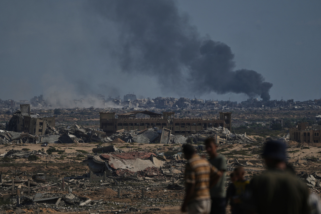 Smoke rises to the sky following an Israeli military strike in Gaza City, as seen from the central Gaza Strip, Thursday, Oct. 2, 2025. (AP Photo/Abdel Kareem Hana)