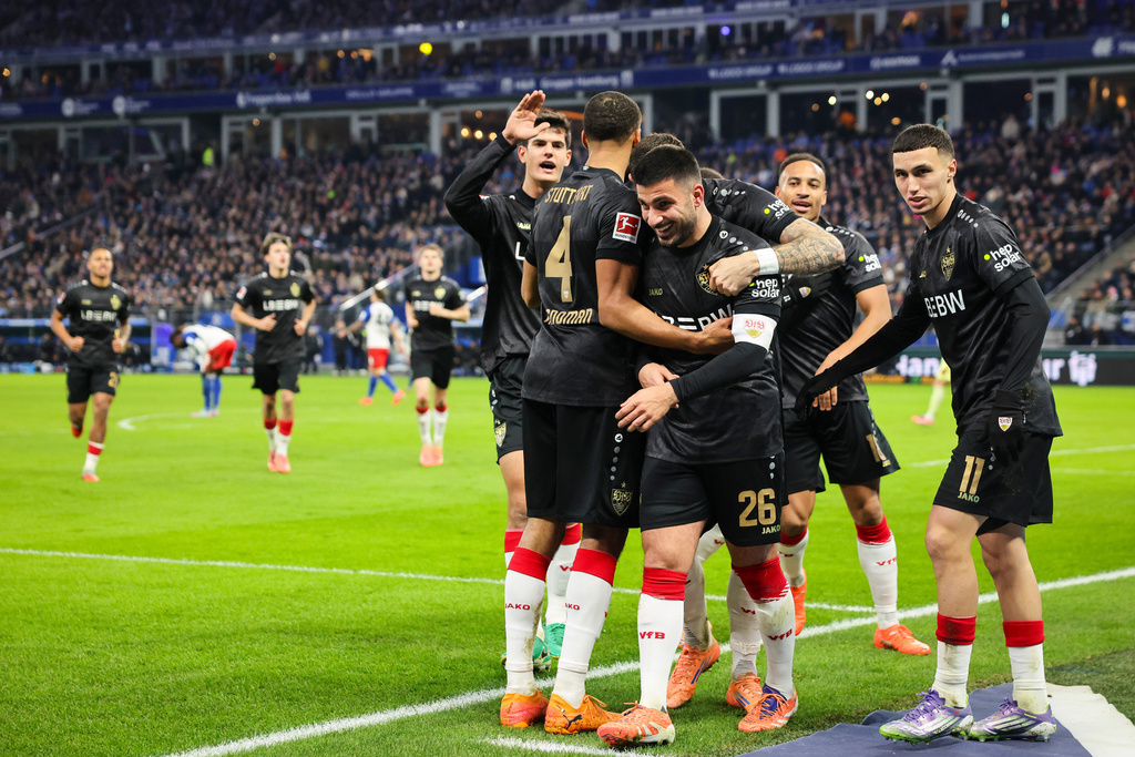 Stuttgart's Deniz Undav, 26, celebrates scoring their side's first goal of the game with teammates during the German Bundesliga soccer match between Hamburger SV and VfB Stuttgart in Hamburg, Germany, Sunday, Nov. 30, 2025. (Christian Charisius/dpa via AP)
