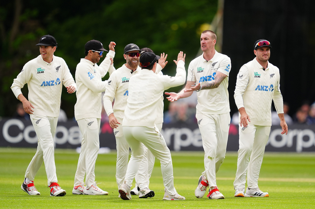 New Zealand's Blair Tickner, second right, and teammates celebrate after Ireland's Harry Tector was caught out by Tom Latham on day three of the test match in Belfast, Northern Ireland, Friday May 29, 2026. (Brian Lawless/PA via AP)