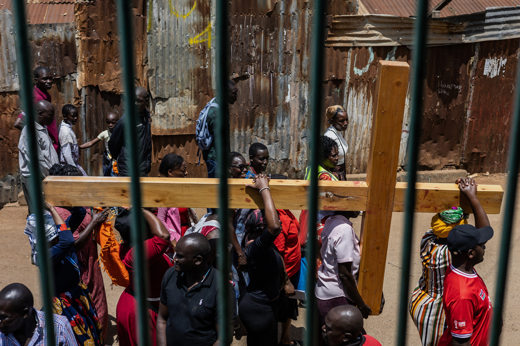 Christians take part in a Way of the Cross re-enactment of the crucifixion of Jesus Christ on Good Friday during Holy Week in Kibera informal settlement in Nairobi, Kenya, Friday, April 3, 2026. (AP Photo/Samson Otieno)