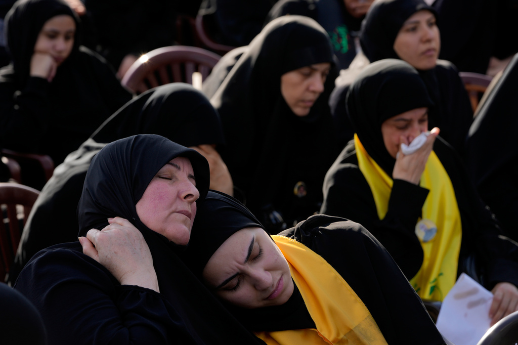 Hezbollah supporters mourn, as they listen to the death story of Imam Hussein during the holy day of Ashoura that commemorates the 7th century martyrdom of the Prophet Muhammad's grandson Hussein, in Dahiyeh, Beirut's southern suburbs, Lebanon, Friday, June 26, 2026. (AP Photo/Hussein Malla)