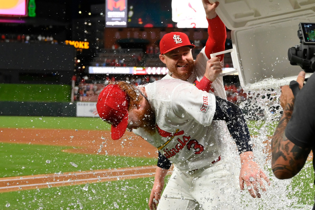 St. Louis Cardinals starting pitcher Dustin May, left, is doused after the team defeated the San Diego Padres in a baseball game, Monday, June 15, 2026, in St. Louis. (AP Photo/Joe Puetz)