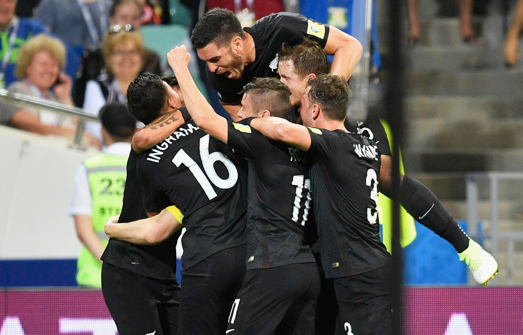 FILE - New Zealand's players celebrate after Chris Wood scored during their Confederations Cup Group A soccer match against Mexico in Sochi, Russia, June 21, 2017. (AP Photo/Martin Meissner, File)