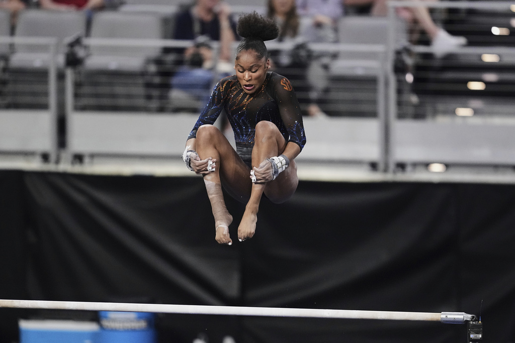 FILE - Florida's Skye Blakely competes on the uneven bars during the NCAA women's gymnastics championships in Fort Worth, Texas, April 17, 2025. (AP Photo/Tony Gutierrez, file)