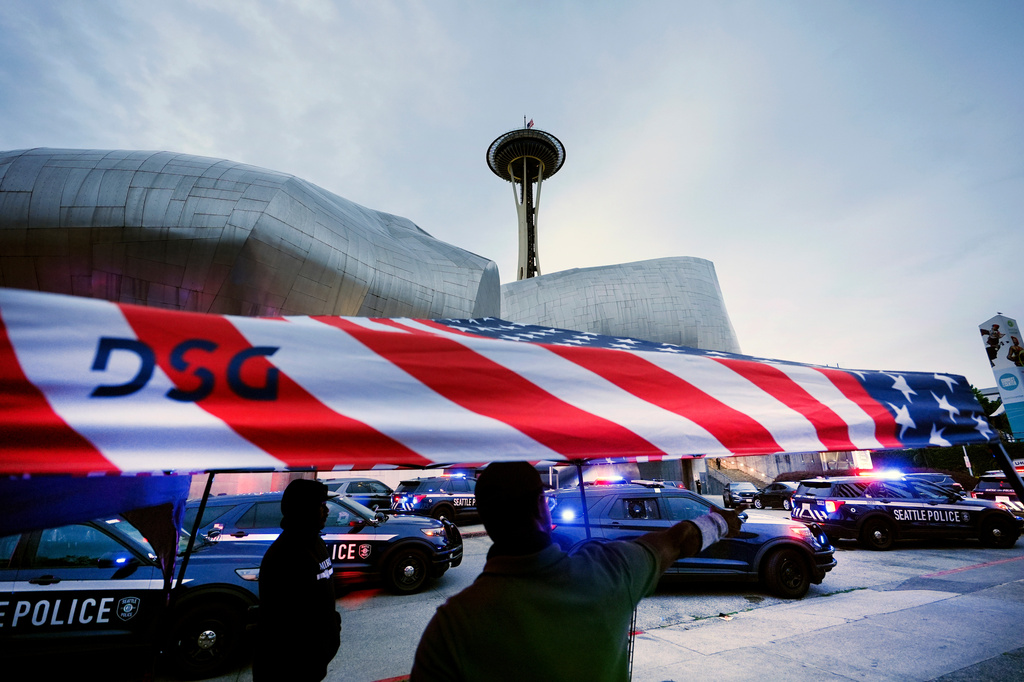 Police respond to a shooting at Seattle Center during the Bite of Seattle food festival Sunday, July 26, 2026, in Seattle, Wash. (AP Photo/Lindsey Wasson)