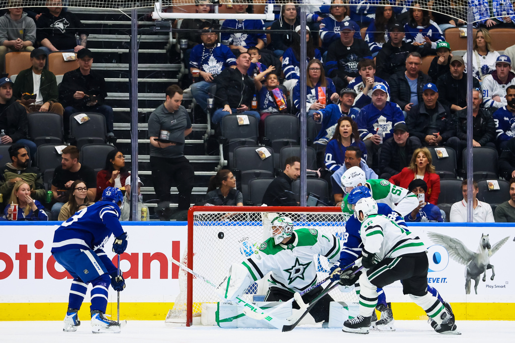 Toronto Maple Leafs right wing William Nylander (88) scores a goal on Dallas Stars goaltender Casey DeSmith (1) during the first period of an NHL hockey game, in Toronto, Monday, April 13, 2026. (Cole Burston/The Canadian Press via AP)