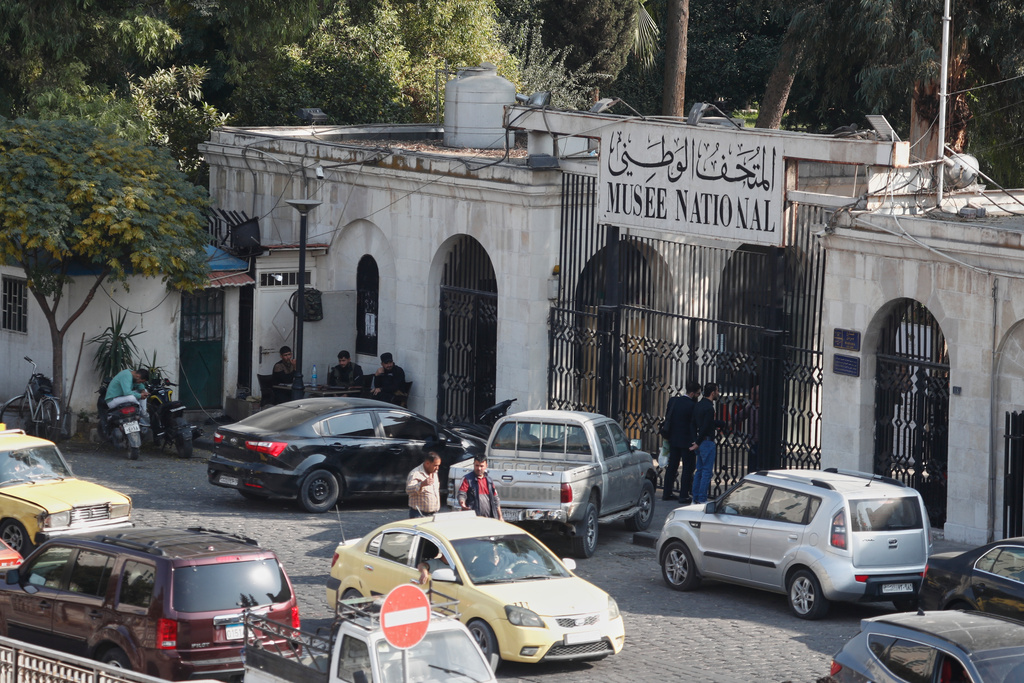 People gather outside the National Museum of Syria in Damascus, Wednesday, Nov. 12, 2025. (AP Photo/Omar Sanadiki)