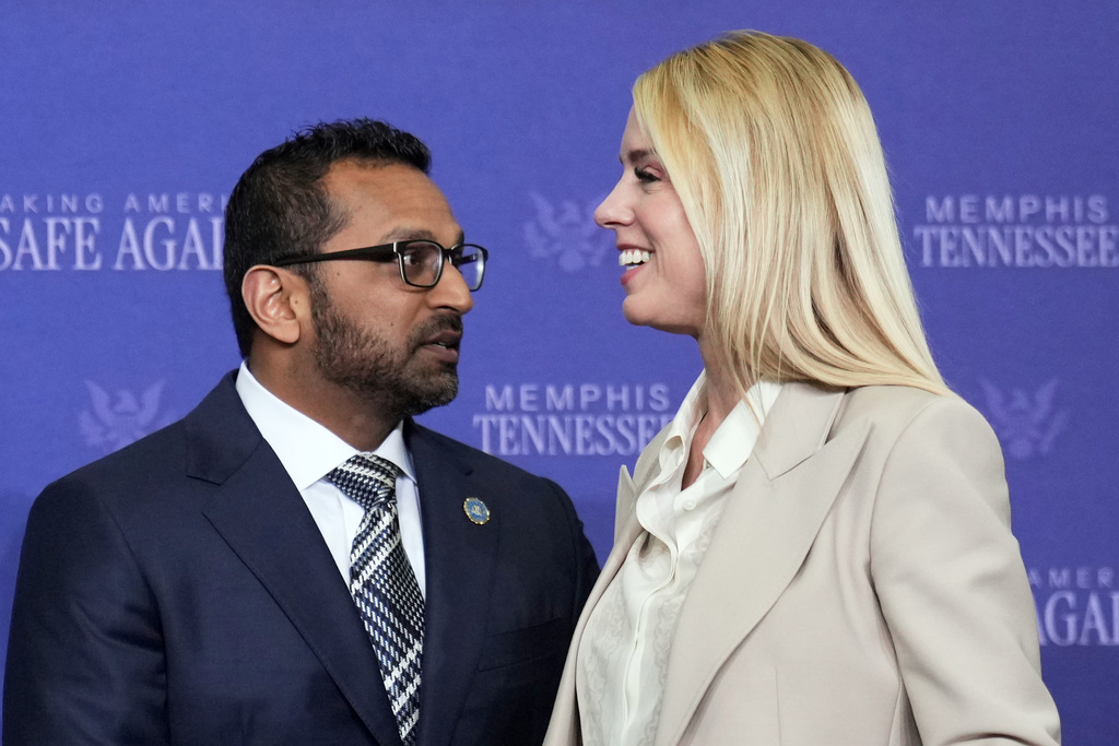 FBI Director Kash Patel and Attorney General Pam Bondi talk before President Donald Trump participates in a roundtable discussion on public safety at a Tennessee Air National Guard Base, Monday, March 23, 2026, in Memphis, Tenn. (AP Photo/Mark Schiefelbein)
