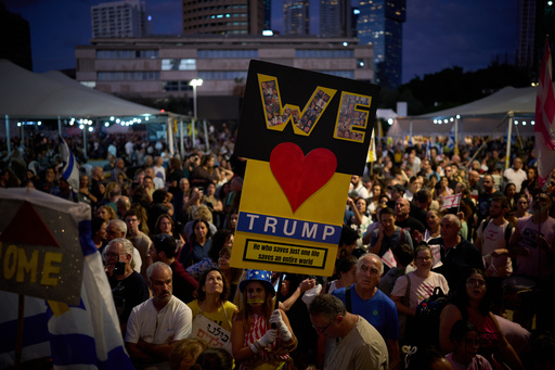 People gather to celebrate following the announcement that Israel and Hamas have agreed to the first phase of a peace plan to pause the fighting, at a plaza known as Hostages Square in Tel Aviv, Israel, Thursday, Oct. 9, 2025. (AP Photo/Emilio Morenatti) People gather to celebrate following the announcement that Israel and Hamas have agreed to the first phase of a peace plan to pause the fighting, at a plaza known as Hostages Square in Tel Aviv, Israel, Thursday, Oct. 9, 2025. (AP Photo/Emilio Morenatti)