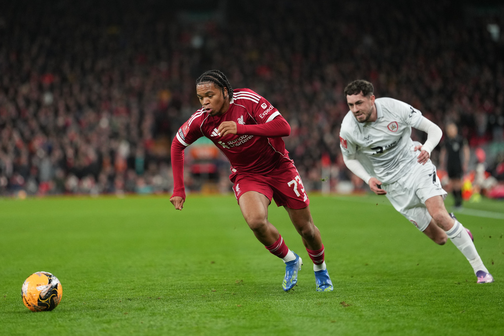 Barnsley's Corey O'Keeffe, left, and -mu73- fight for the ball during the FA Cup third round soccer match between Liverpool and Barnsley in Liverpool, England, Monday, Jan. 12, 2026. (AP Photo/Jon Super)
