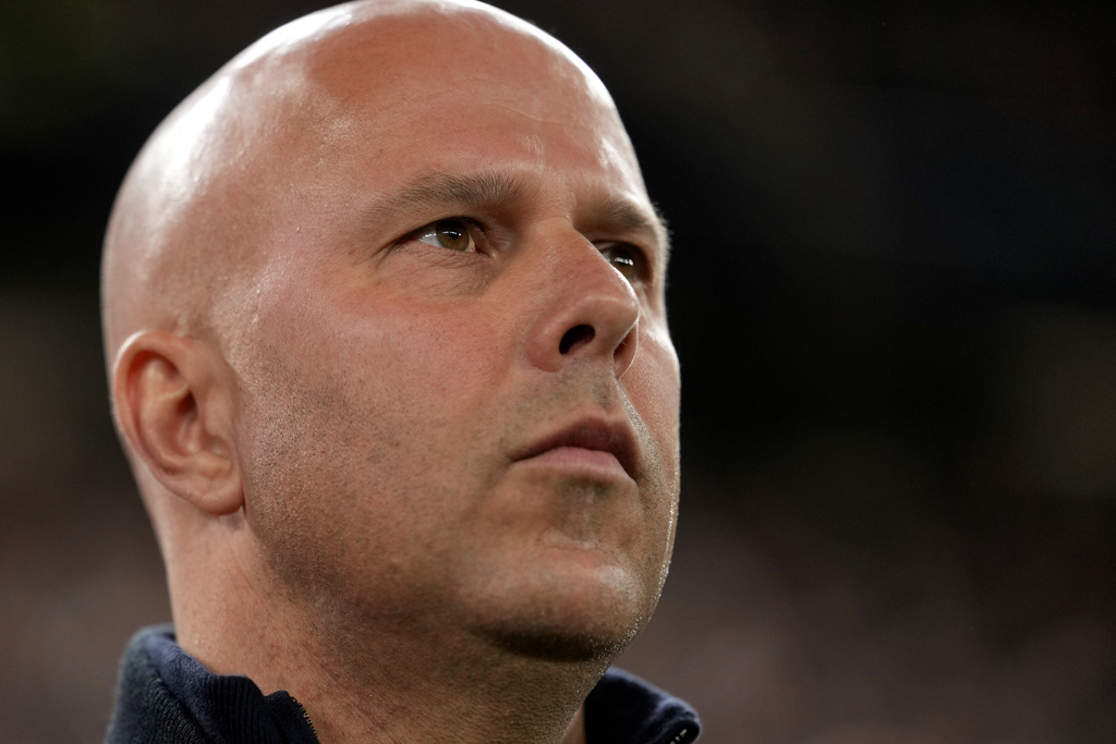 Liverpool's manager Arne Slot looks on during the warm up prior to the second leg of the Champions League round of 16 soccer match between Liverpool and Galatasaray, in Liverpool, England, Wednesday, March 18, 2026. (AP Photo/Jon Super)