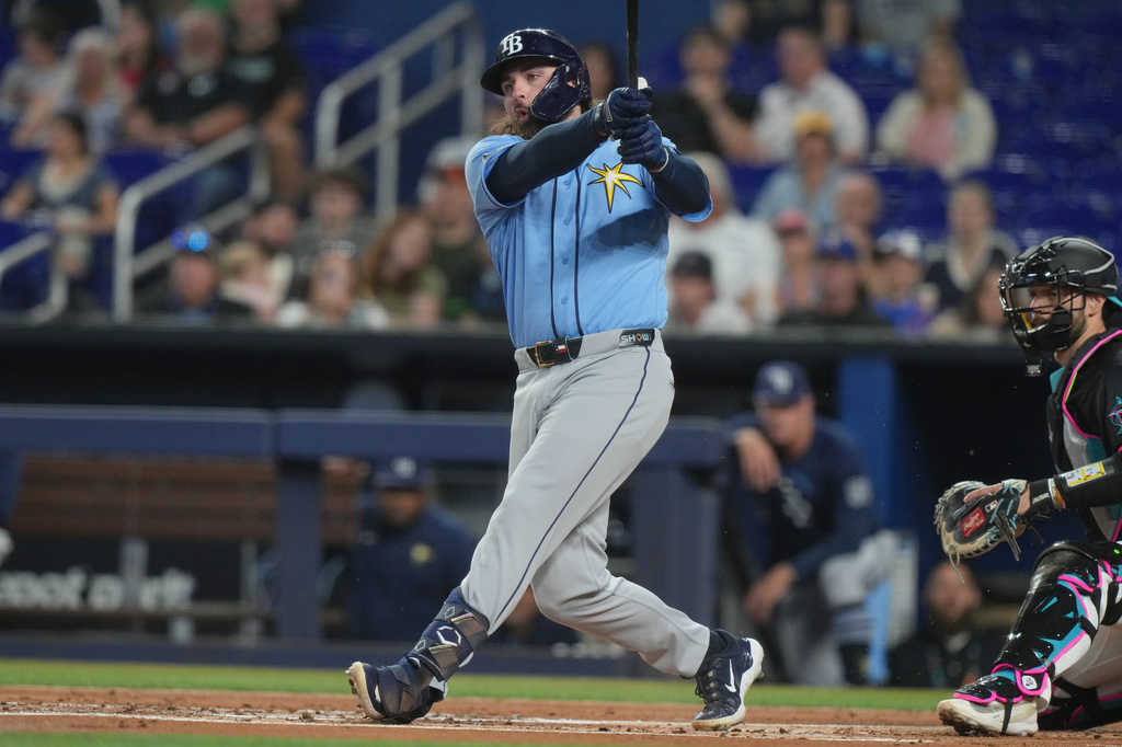 Tampa Bay's Ryan Vilade hits a single during the first inning of a baseball game against the Miami Marlins Friday, June 5, 2026, in Miami. (AP Photo/Marta Lavandier)