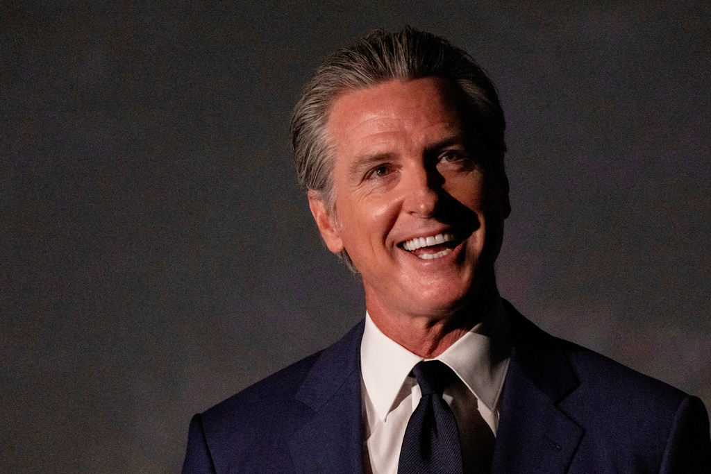 California Gov. Gavin Newsom hosts a press conference and signs a slew of climate initiative bills at the Academy of Sciences, Friday, Sept. 19, 2025, in San Francisco. (AP Photo/Camille Cohen)