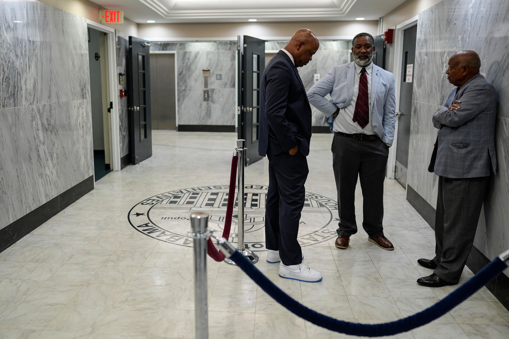 Democratic Rep. Christopher England speaks to people as the House debates HB 1, a redistricting bill, during a special session of the Alabama Legislature, Wednesday, May 6, 2026, in Montgomery, Ala. (AP Photo/Mike Stewart)