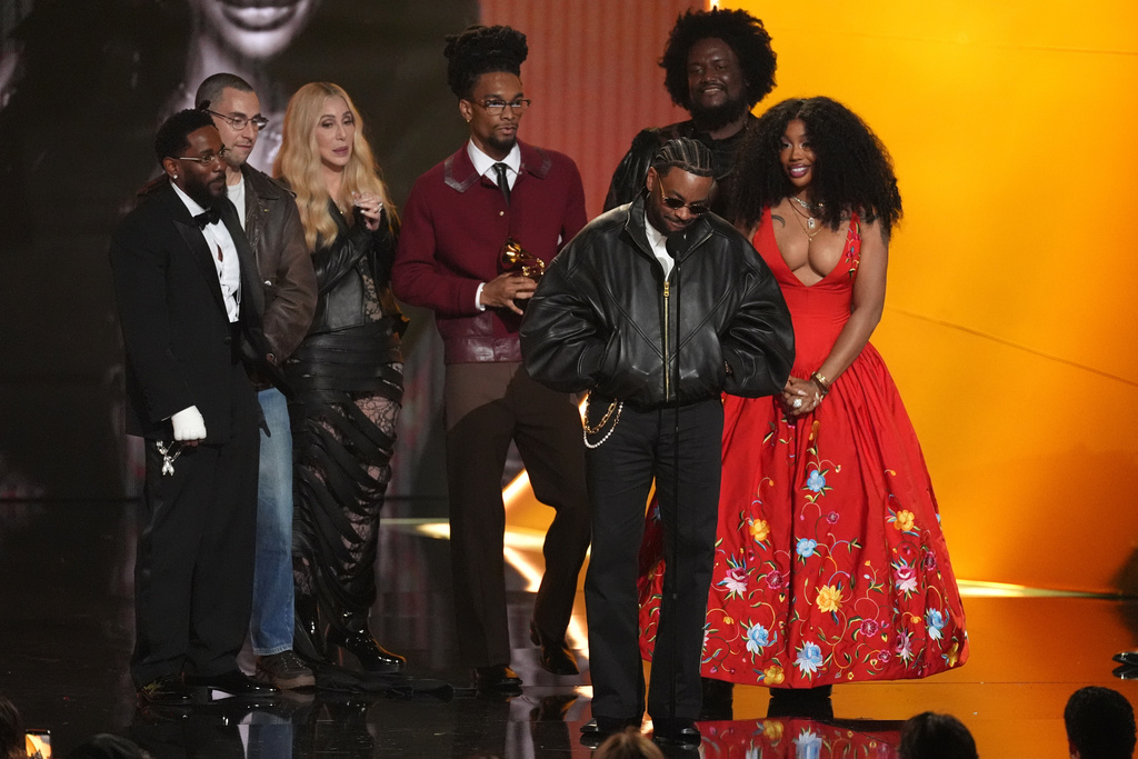 Kendrick Lamar, from left, Jack Antonoff, Ruchaun Aker, Sounwave, Kamasi Washington, and SZA accept the award for record of the year for "Luther" during the 68th annual Grammy Awards on Sunday, Feb. 1, 2026, in Los Angeles. Cher, third from left, looks on from left. (AP Photo/Chris Pizzello)