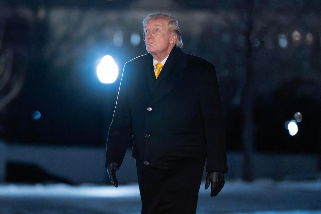 President Donald Trump walks on the South Lawn upon his arrival to the White House, Monday, Feb. 9, 2026, in Washington. (AP Photo/Jose Luis Magana)