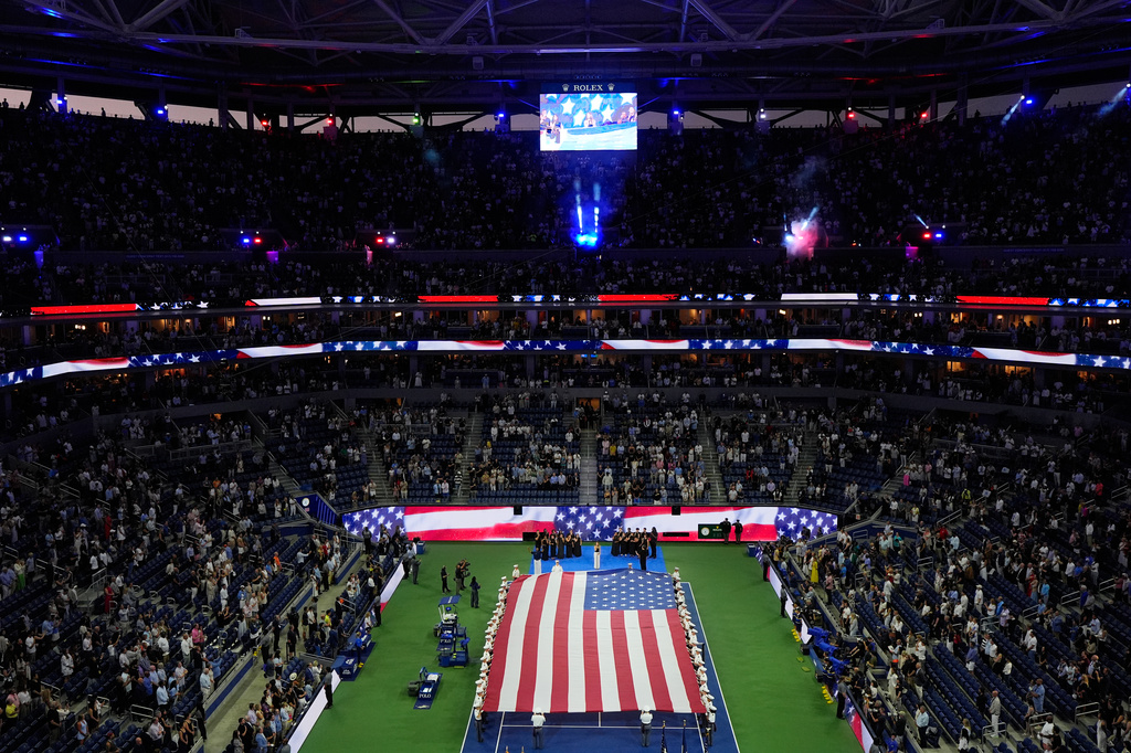 JoJo sings the national anthem ahead of a match between Frances Tiafoe, of the United States, and Ben Shelton, of the United States, during the men's singles semifinals of the U.S. Open tennis championships Friday, Sept. 11, 2026, in New York. (AP Photo/Yuki Iwamura)