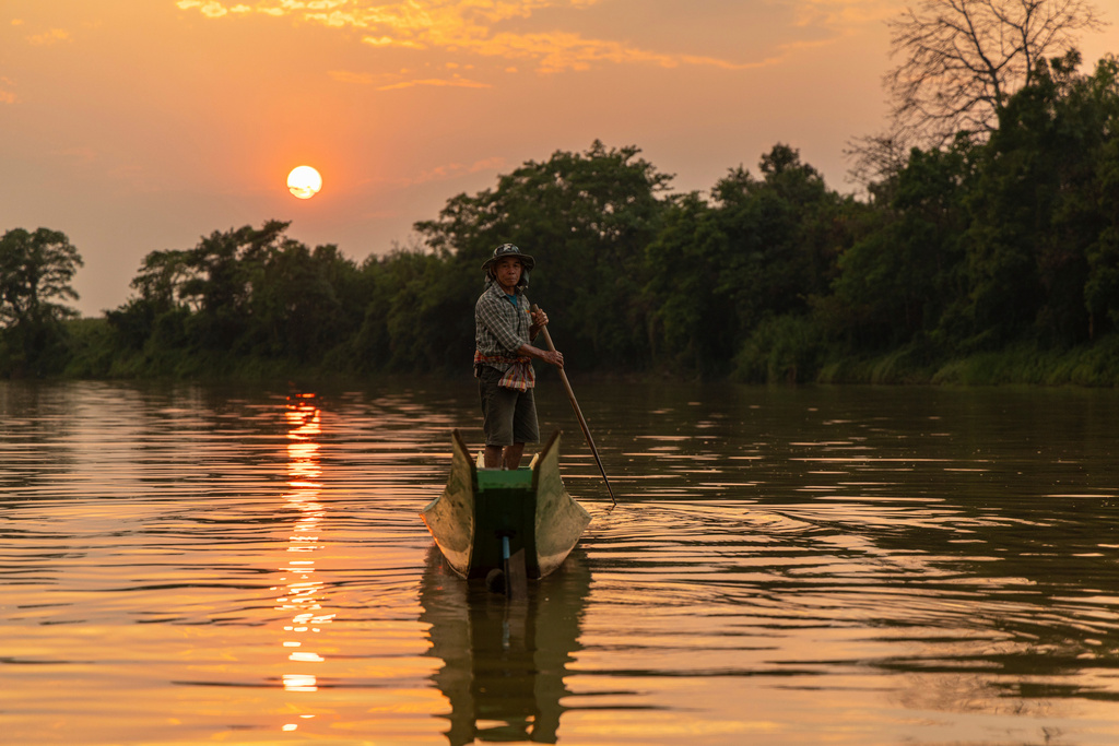 Fisherman Sukjai Yana steers a boat down the Kok River in Chiang Saen, Thailand, Saturday, Feb. 21, 2026. (AP Photo/Anton L. Delgado)